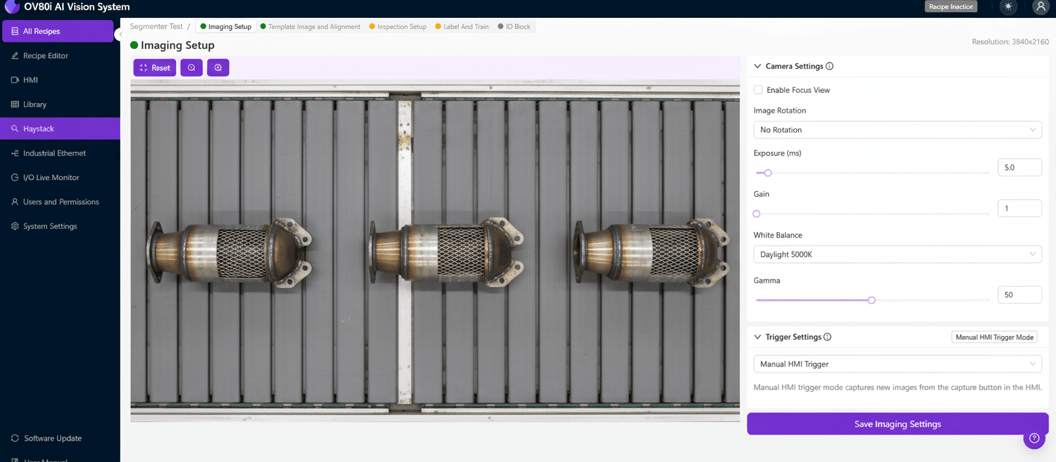 AI machine vision inspecting a catalytic converter on an automotive manufacturing assembly line, detecting weld defects.
