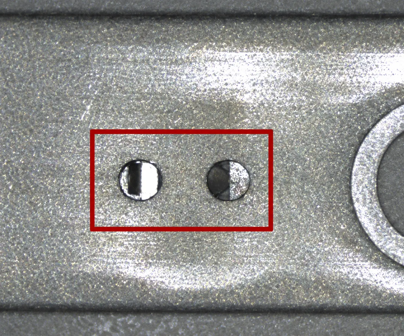 Metal bracket with two small component positions inspected together