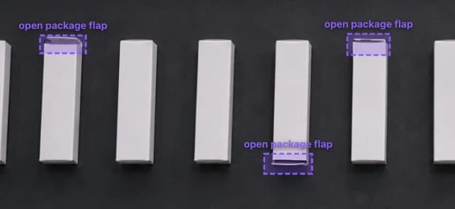 Row of cartons on the line with three open package flap detections localized by the OV20i